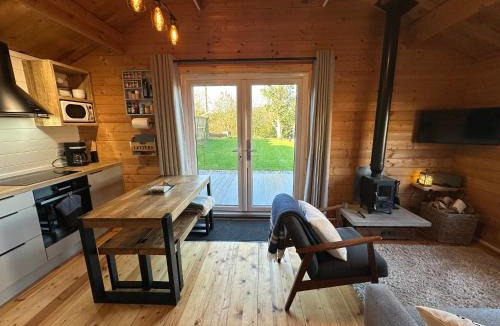 Hawkinge House | The Cabin log fire cosy home