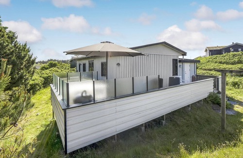Rindby Strand House | The charming and well-maintained house is situated on a charming dune plot.