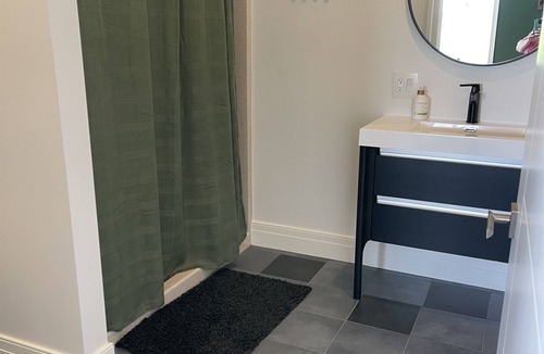 Hector House | The Jade Suite at Diamond on Seneca: King Bed with Lake Views