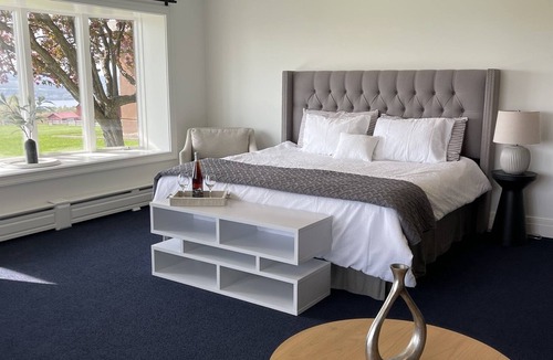 Hector House | The Jade Suite at Diamond on Seneca: King Bed with Lake Views