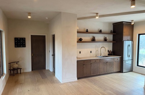 Janesville Cabin | The Overhang · Luxury River Retreat with Sauna, Hot Tub, Movie Theater, & Arcade