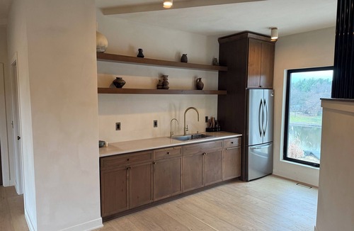 Janesville Cabin | The Overhang · Luxury River Retreat with Sauna, Hot Tub, Movie Theater, & Arcade