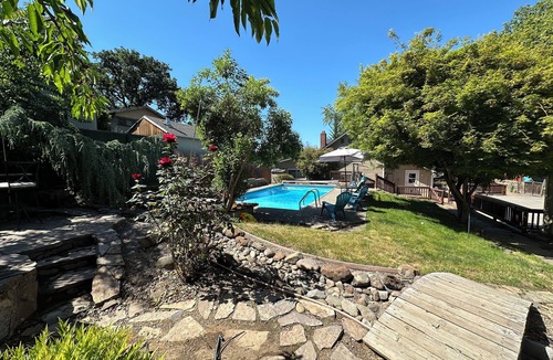 Medford Apartment | The Pool House, step into a backyard oasis.
