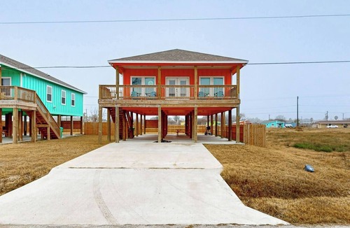 Aransas Pass House | The Sol & Mar Retreat, two neighboring homes in Aransas Pass perfect for large groups! Enjoy 6 bedrooms, 4 baths, 2 king beds, 8 queen beds, spacious yards, covered outdoor areas, and boat parking near beaches, fishing, and coastal attractions.