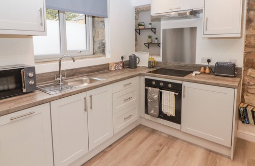 Tavernspite Cottage | THE STABLE, romantic, with open fire in Amroth