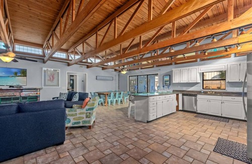 Thomas Drive House | The Tiki Hut ~ Tropical Retreat with Pool, Tiki Bar, Game Room & Dog-Friendly Vibes