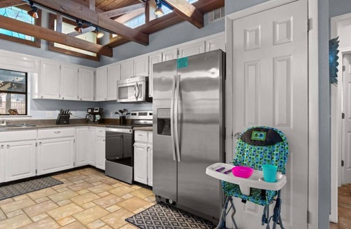 Thomas Drive House | The Tiki Hut ~ Tropical Retreat with Pool, Tiki Bar, Game Room & Dog-Friendly Vibes