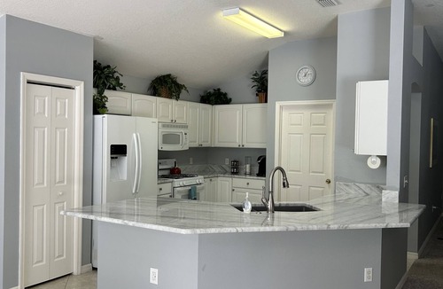 The Villages House | The Villages POOL home with a golf course view