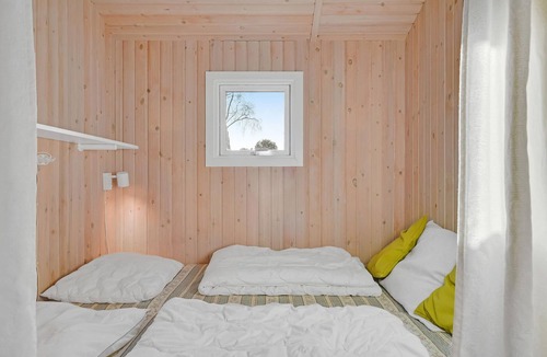 Østerskov House | This beautiful wooden house is located in a smaller cottage area, nestled in beautiful nature.