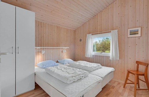 Østerskov House | This beautiful wooden house is located in a smaller cottage area, nestled in beautiful nature.
