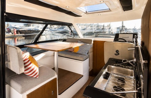 La Condamine Boat Rental | This boat accommodation features two separate bedrooms, a fully equipped kitchenette with a refrigerator and stovetop, and one bathroom. Towels and bed linen are provided for your stay.
