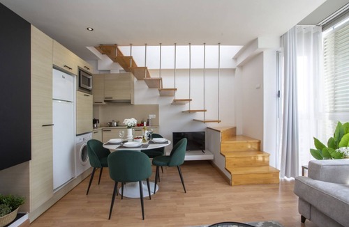 Castello de la Plana Apartment | This charming duplex penthouse for 4 people is the perfect combination of spaciousness, light, and comfort. On the lower floor, you'll find a cozy studio with a 150 cm double bed in the sleeping area, partially separated from the living room by a wall fo