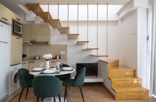 Castello de la Plana Apartment | This charming duplex penthouse for 4 people is the perfect combination of spaciousness, light, and comfort. On the lower floor, you'll find a cozy studio with a 150 cm double bed in the sleeping area, partially separated from the living room by a wall fo
