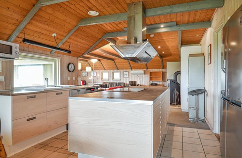 Houvig Strand House | This cozy cottage is located under a romantic thatched roof.