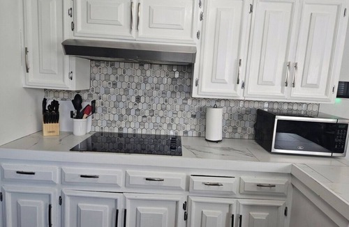 Odessa House | This modern 4-Bedroom features a spacious interior and exquisite backyard.