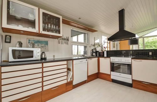 Rindby Strand House | This renovated cottage has among other things a beautiful kitchen with skylight, window front to the