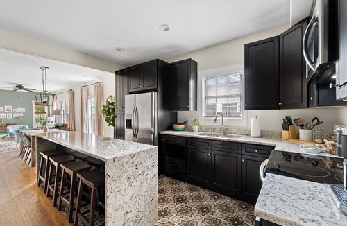 Kessler Apartment | This spacious unit is the entire first floor of a historic triplex dating back to 1912. It has been completely renovated and designed with your comfort in mind. An easy walk (just 1.5 blocks) from Bishop Arts District. Secure gated parking.
