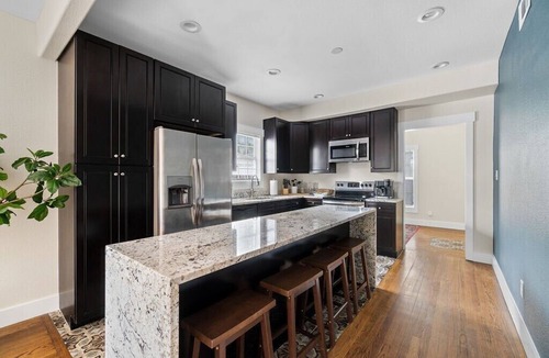 Kessler Apartment | This spacious unit is the entire first floor of a historic triplex dating back to 1912. It has been completely renovated and designed with your comfort in mind. An easy walk (just 1.5 blocks) from Bishop Arts District. Secure gated parking.