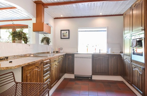 Varde House | This vacation home is located directly in the forest, yet close to the town of Varde.