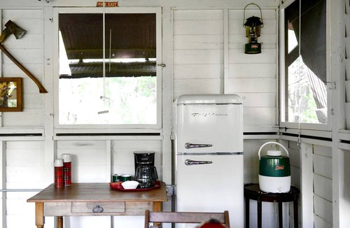 East Troy Cabin | Three Cozy Historic Scout Cabins with Fire Pit, BBQ, and Hammocks for a Memorable Family Adventure in Troy, Wisconsin
