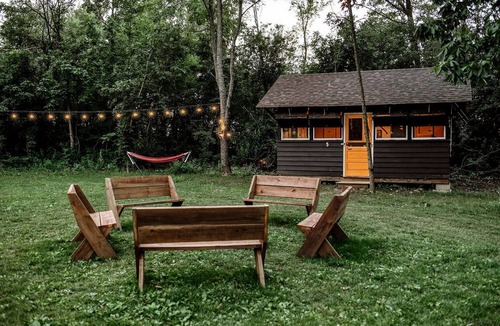 East Troy Cabin | Three Cozy Historic Scout Cabins with Fire Pit, BBQ, and Hammocks for a Memorable Family Adventure in Troy, Wisconsin