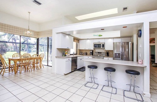Beachview Country Club Estates House | Tin Cup - Beachview Estates home with pool on golf course