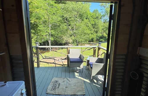 Hillsville Cabin | Tiny cabin sits by a bubbling, stocked creek. Pet friendly for a fee, hot tub
