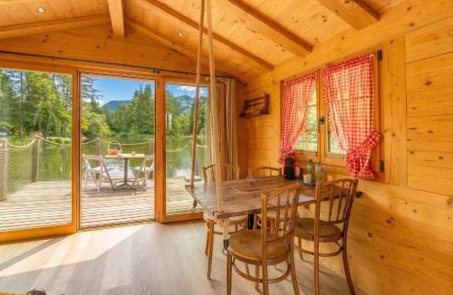 Zweisimmen House | Tiny Water Villa on a Lake with shared camping bathroom