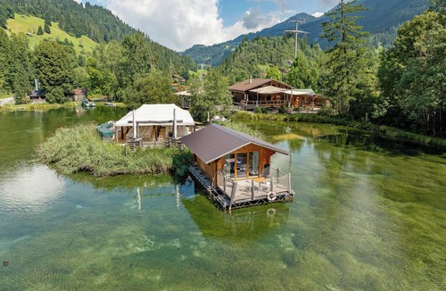 Zweisimmen House | Tiny Waterhouse on a Lake with shared Bathroom
