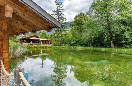 Zweisimmen House | Tiny Waterhouse on a Lake with shared Bathroom