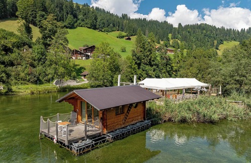Zweisimmen House | Tiny Waterhouse on a Lake with shared Bathroom