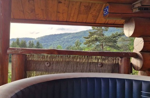 Saint-Sauveur-Camprieu Ski Chalet | Traditional log cabin with Jacuzzi and wooded garden in the Cévennes