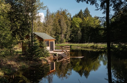 Bobcaygeon Ski Chalet | Tranquil Oasis in Trent Lakes w/Private Ponds, Fire Pit, Game Room & Hot Tub
