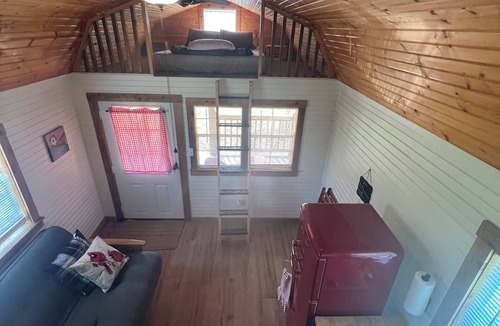 Cassville RV Rental | Tranquil Retreat: Charming Pet-Friendly Tiny House Cabin Amidst Nature's Beauty!