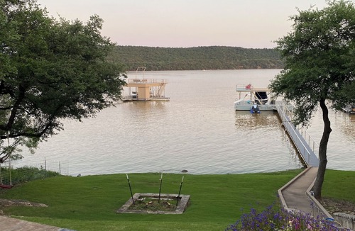 Graham House | Tranquil Waterfront property with a pool, hot tub, fire-pit & large patio.