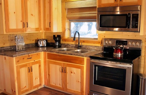 Cat Spring Cabin | Tranquility Cabin Surrounded By Live Oak Trees With A Fabulous Hot Tub!