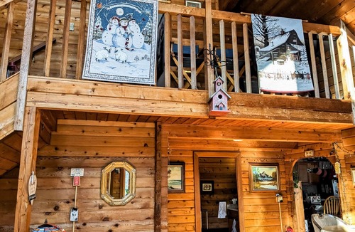 Raymond House | Tranquility, stone fireplace, lofted ceilings, wall of windows, & views