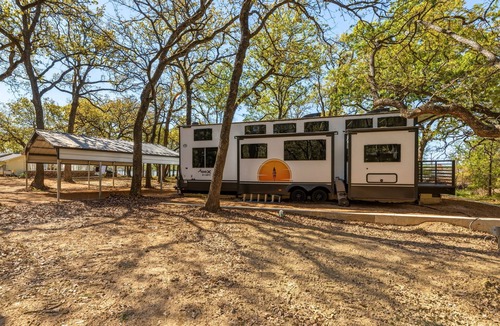 StarCrest Estates House | Travel Trailer at the Water w Easy Access, Hot Tub, Grill, 2-Tier Deck