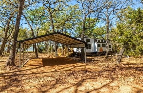 StarCrest Estates House | Travel Trailer at the Water w Easy Access, Hot Tub, Grill, 2-Tier Deck