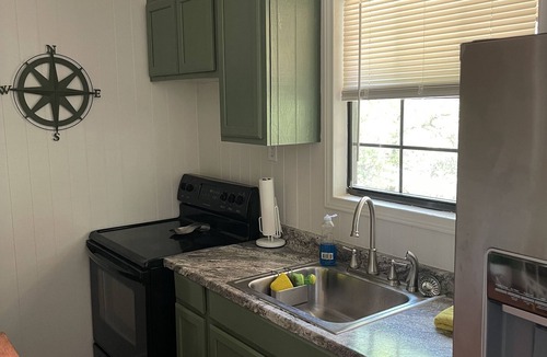 Marble Falls Cottage | Traveler Creek Inn nestled in the woods