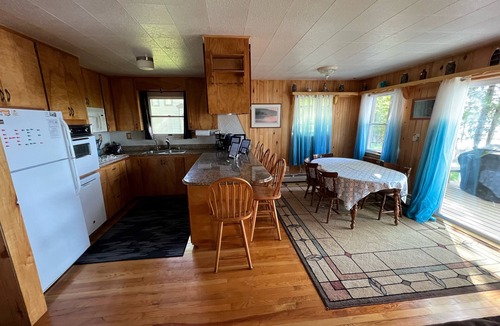 Traverse City House | Traverse City Lake Front w/Fireplace, Sauna, & Kayaks. Dogs welcome. June Avail