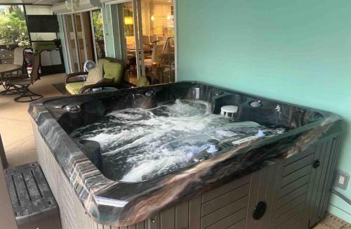 Snug Harbor Estates Villa | Tropical Waterfront Beach Home with Pool & Jacuzzi