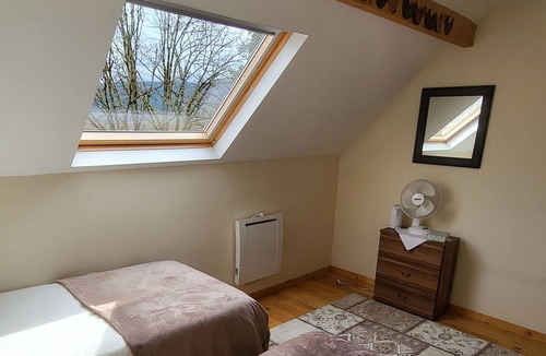 Bersac-sur-Rivalier Bed & Breakfast | Twin room ensuite with views across the valley and Ambersac mountains.