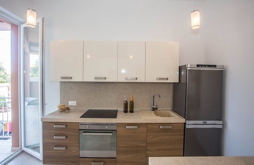 Tar Apartment | Two-Bedroom Apartment in Villa Valtrazza Noa IV with Balcony and Pool View