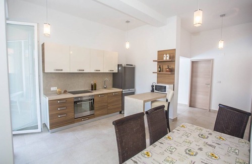 Tar Apartment | Two-Bedroom Apartment in Villa Valtrazza Noa IV with Balcony and Pool View
