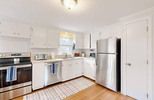 Harwich House | Two-story dog-friendly retreat with enclosed yard, playset, W/D, & firepit