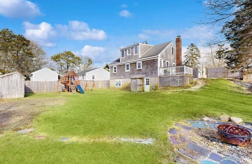 Harwich House | Two-story dog-friendly retreat with enclosed yard, playset, W/D, & firepit
