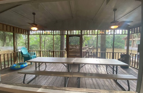 Karnack House | Two Story House with deck over the river