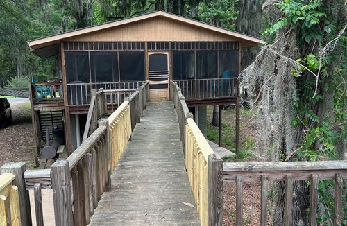 Karnack House | Two Story House with deck over the river