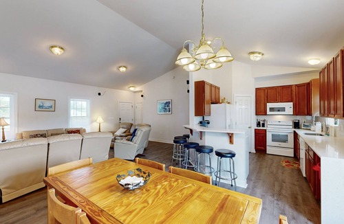 Orange House | Two-story, lakefront getaway with dock, beach, grill, 2 kayaks, 2 canoes, AC